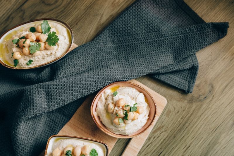 Falafel and hummus grain bowl with fresh herbs